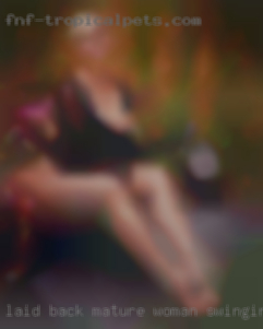 Laid back and  chilled mature woman swinging out.